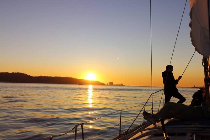 Sailboat Tour in Lisbon with drinks included | Morning and Sunset - Watching the sunset from the open deck