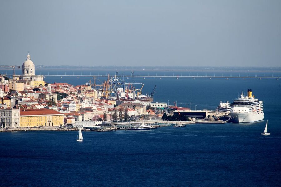 South Lisbon: 3-Hour Christ the King Electric Bike Tour - Crossing the Tagus on an orange cacilheiro