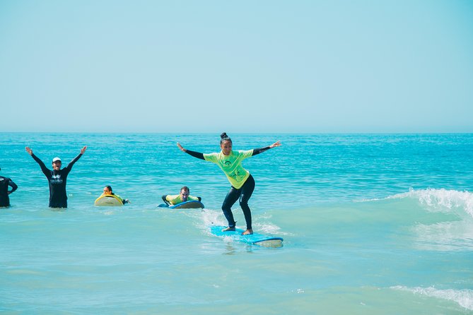 Surf Lesson on Praia de Carcavelos - Wetsuits, boards, and shaded rest areas