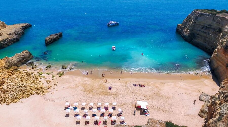 Vilamoura: Guided Sightseeing Cruise with Beach BBQ & Drinks - Arriving by dinghy at an isolated beach